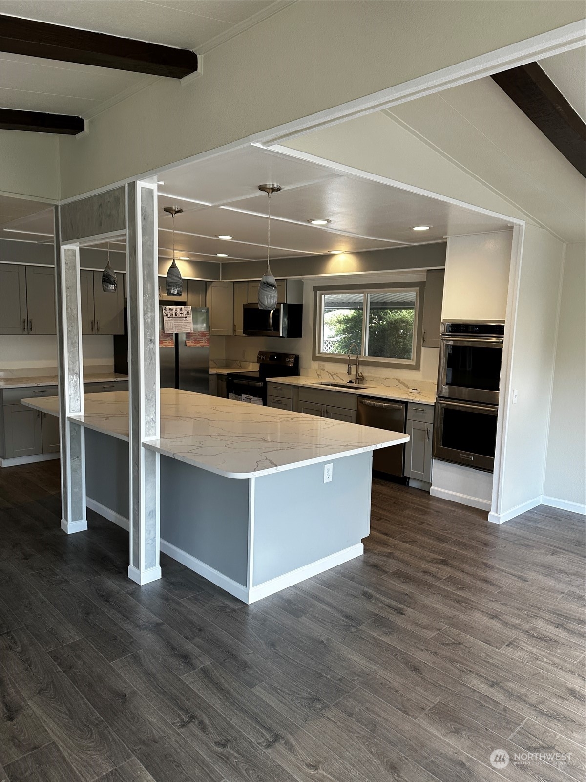 201 Union Avenue Southeast, Unit 90 Renton, WA 98059 - Photo 2 of 22 a view of kitchen with cabinets and wooden floor
