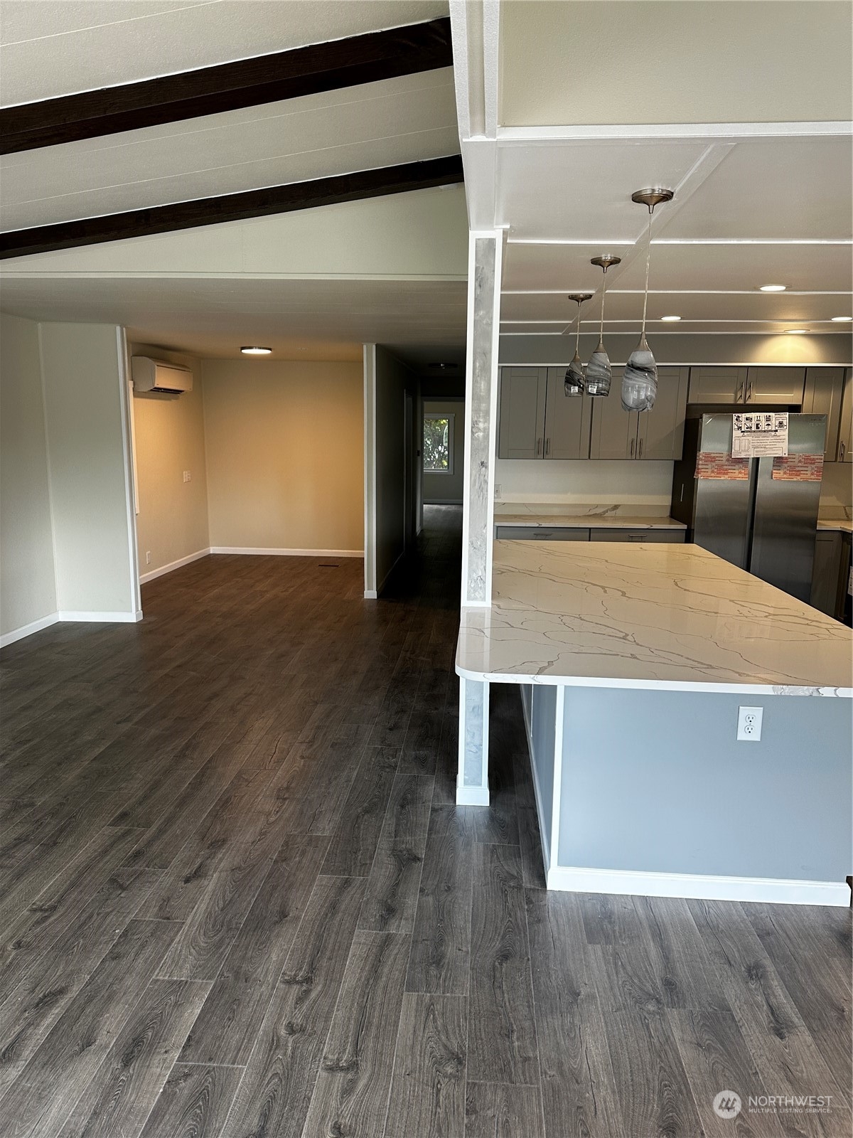 201 Union Avenue Southeast, Unit 90 Renton, WA 98059 - Photo 4 of 22 a view of kitchen with furniture and wooden floor