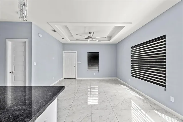 wooden floor in a room next to a window