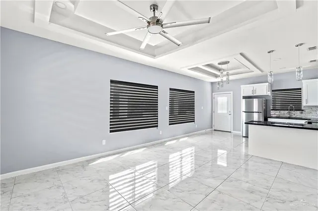 a view of a kitchen with a stove and a window