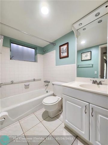 a bathroom with a sink a toilet and bathtub