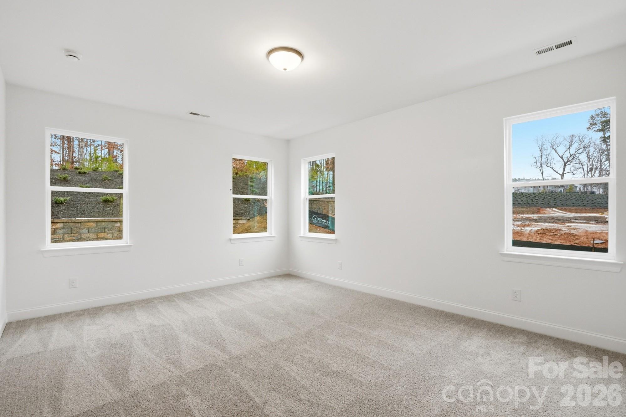 5072 Mclaughlin Loop Waxhaw, NC 28173 - Photo 18 of 46 a view of an empty room with a window