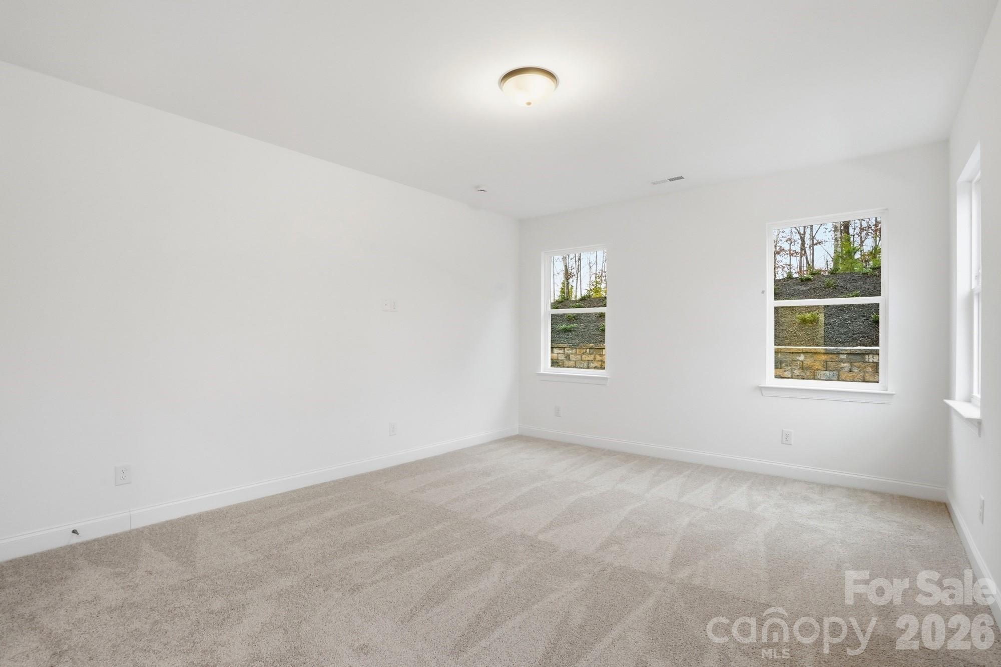5072 Mclaughlin Loop Waxhaw, NC 28173 - Photo 19 of 46 an empty room with windows