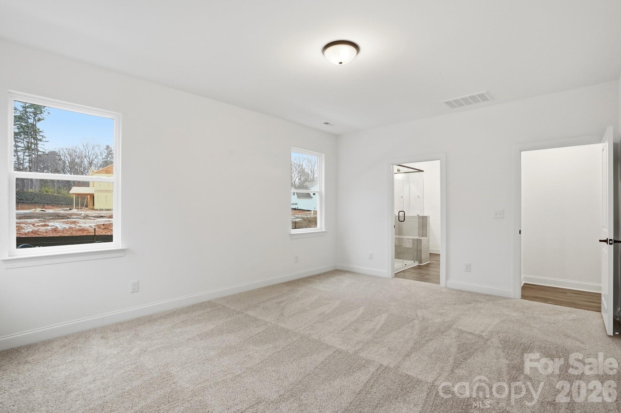 5072 Mclaughlin Loop Waxhaw, NC 28173 - Photo 20 of 46 a view of an empty room with a window