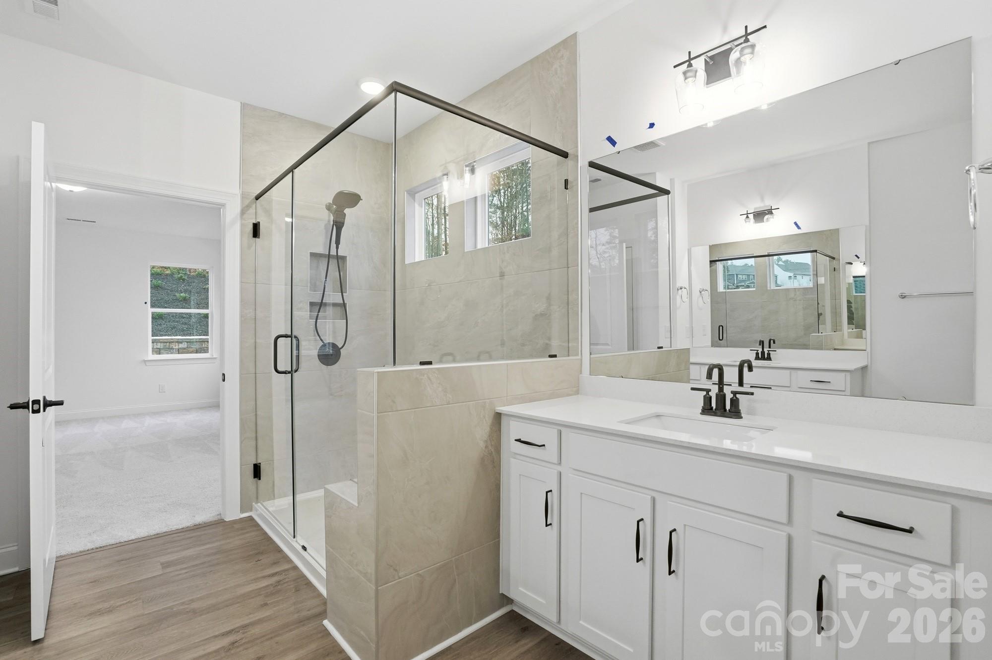 5072 Mclaughlin Loop Waxhaw, NC 28173 - Photo 23 of 46 a bathroom with a double vanity sink mirror double and shower