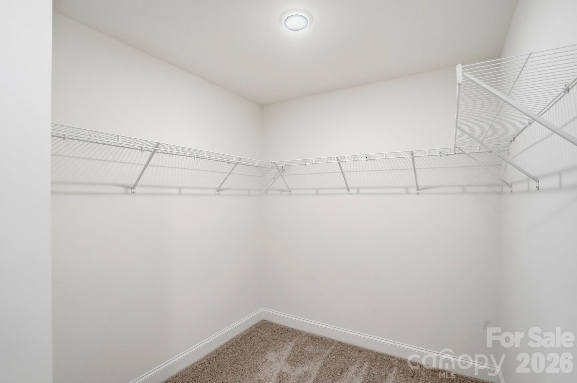 5072 Mclaughlin Loop Waxhaw, NC 28173 - Photo 25 of 46 a view of a room with racks on the wall