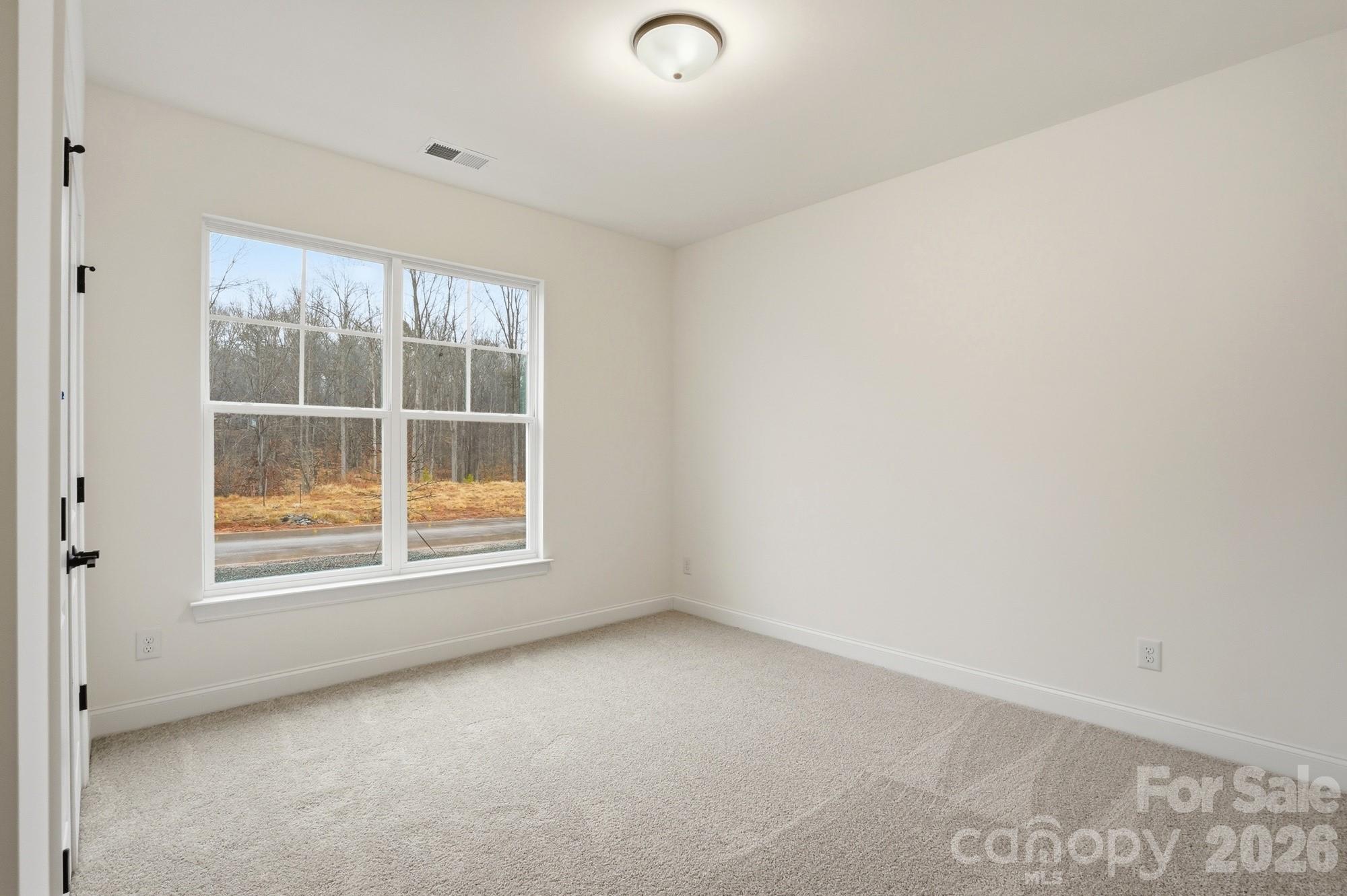 5072 Mclaughlin Loop Waxhaw, NC 28173 - Photo 27 of 46 an empty room with a window