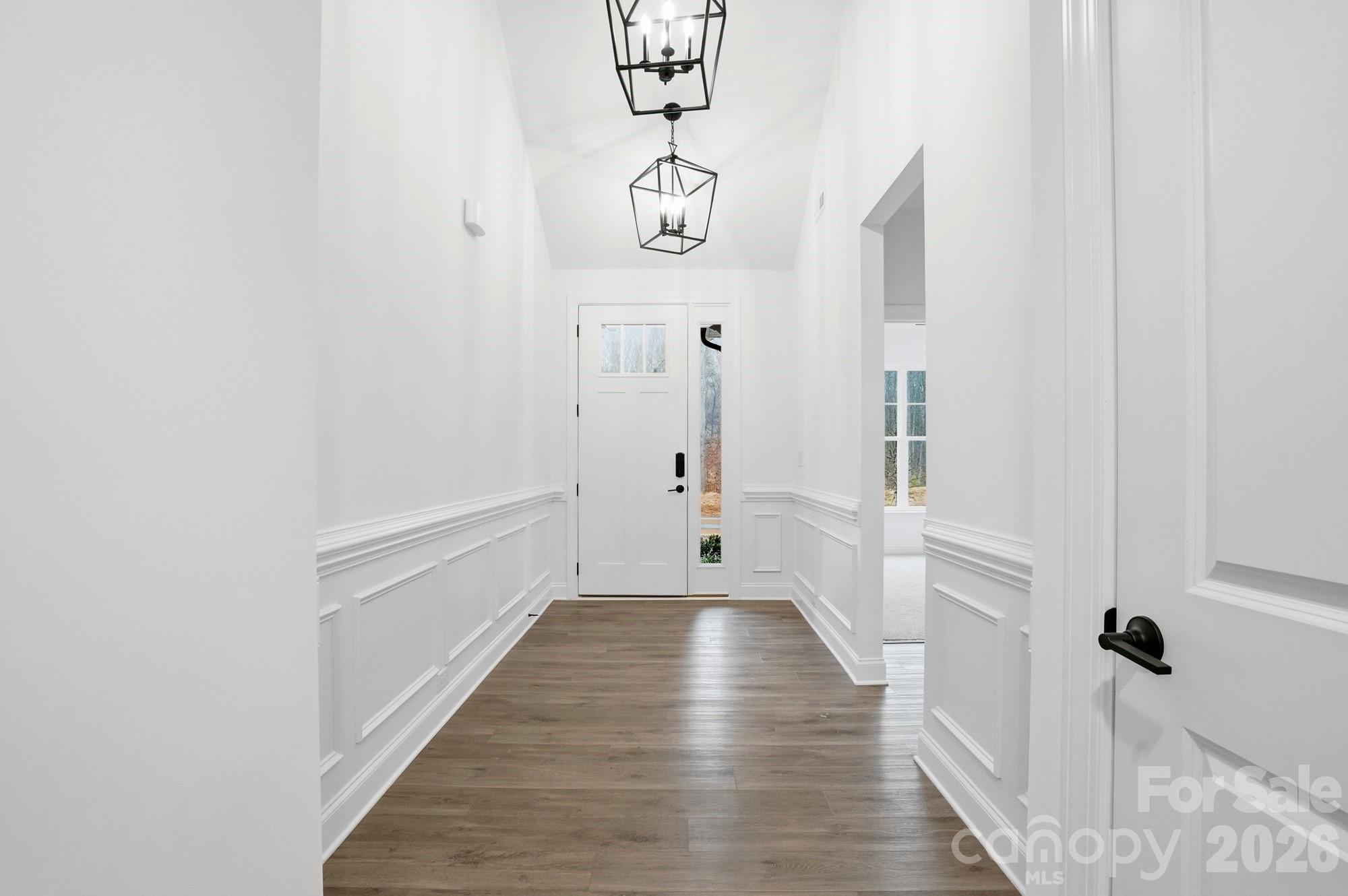 5072 Mclaughlin Loop Waxhaw, NC 28173 - Photo 3 of 46 a hallway with wooden floor