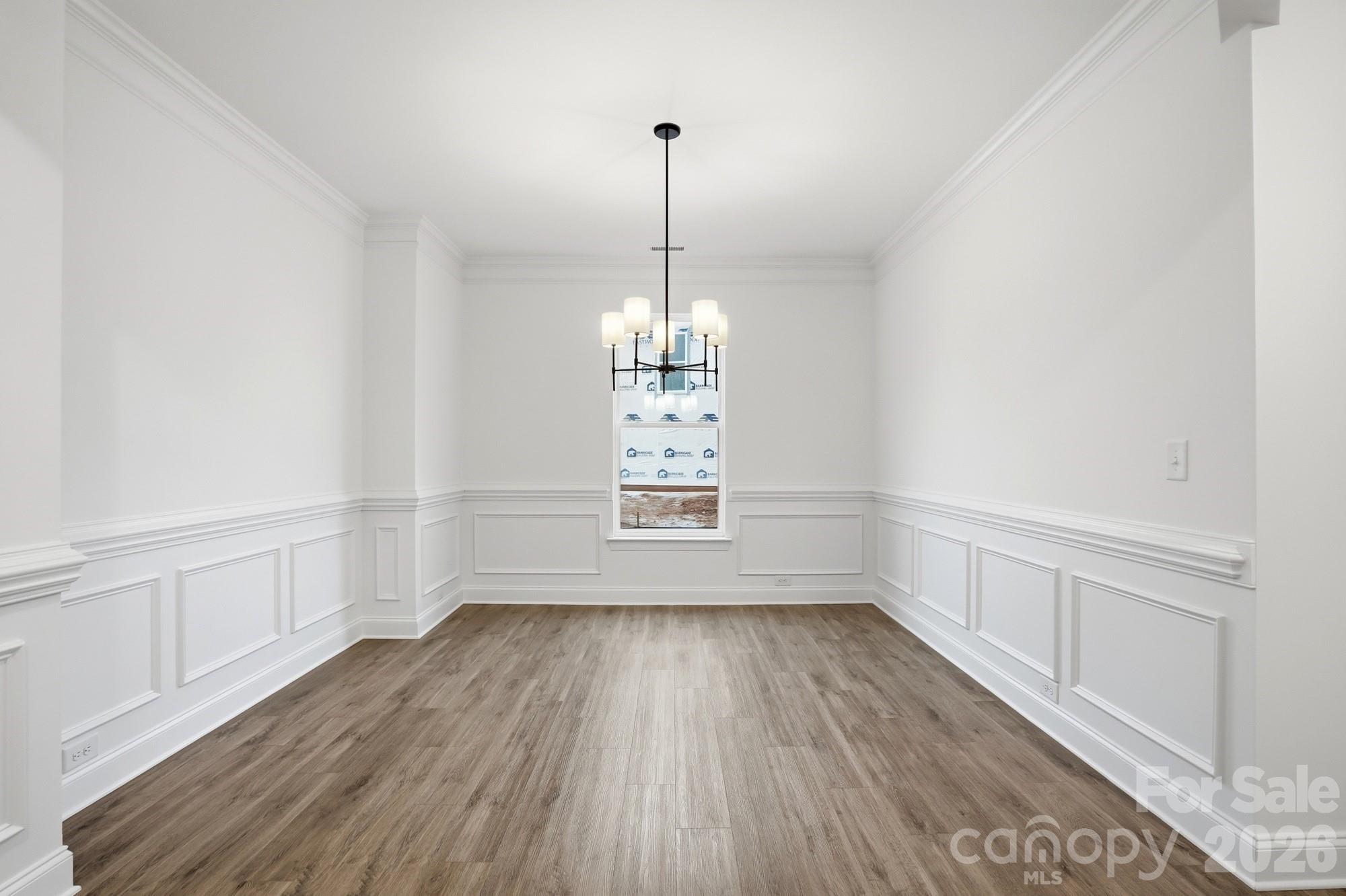 5072 Mclaughlin Loop Waxhaw, NC 28173 - Photo 32 of 46 a view of empty room with wooden floor and fan