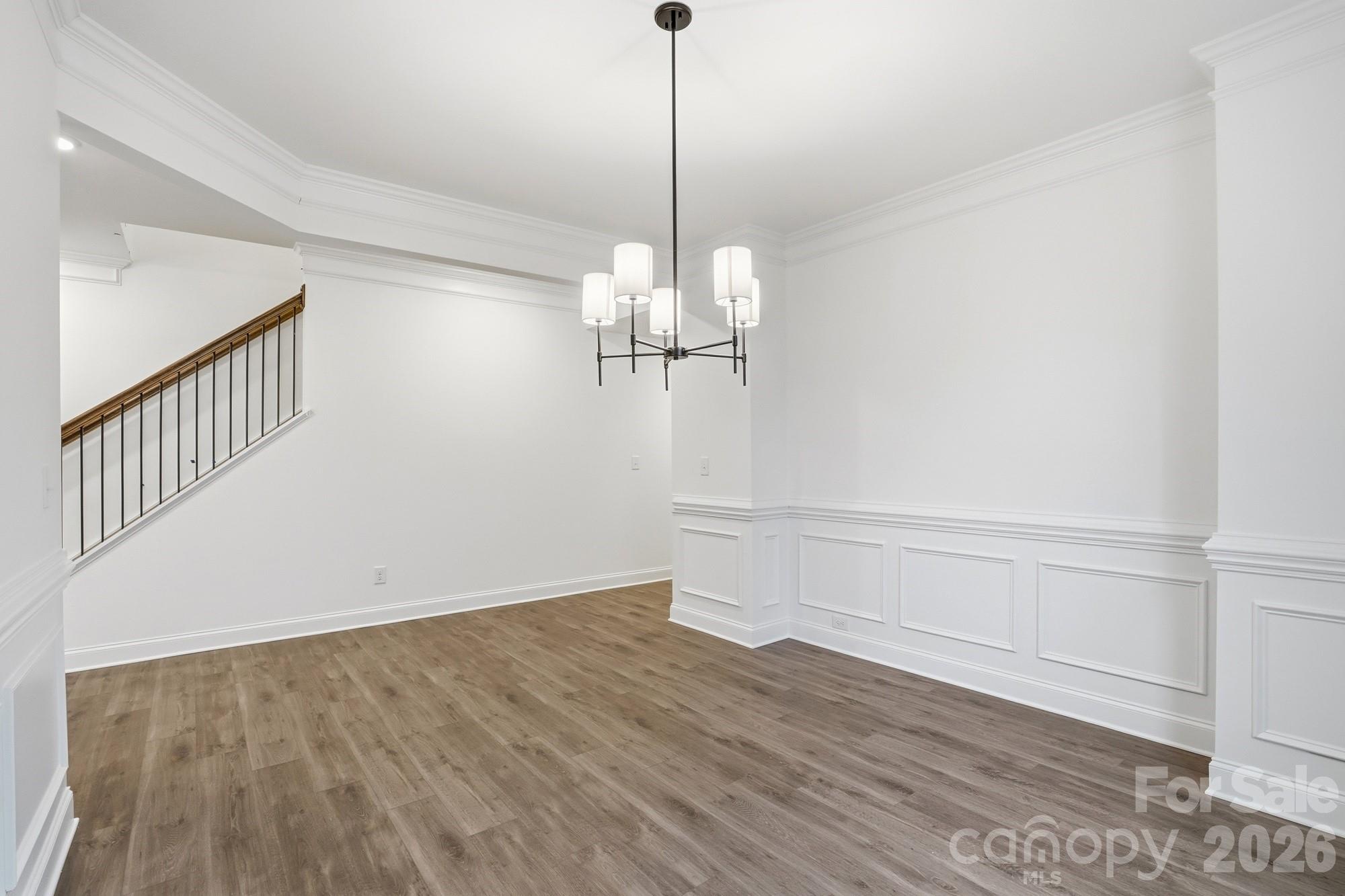 5072 Mclaughlin Loop Waxhaw, NC 28173 - Photo 33 of 46 a view of a room with wooden floor and white walls