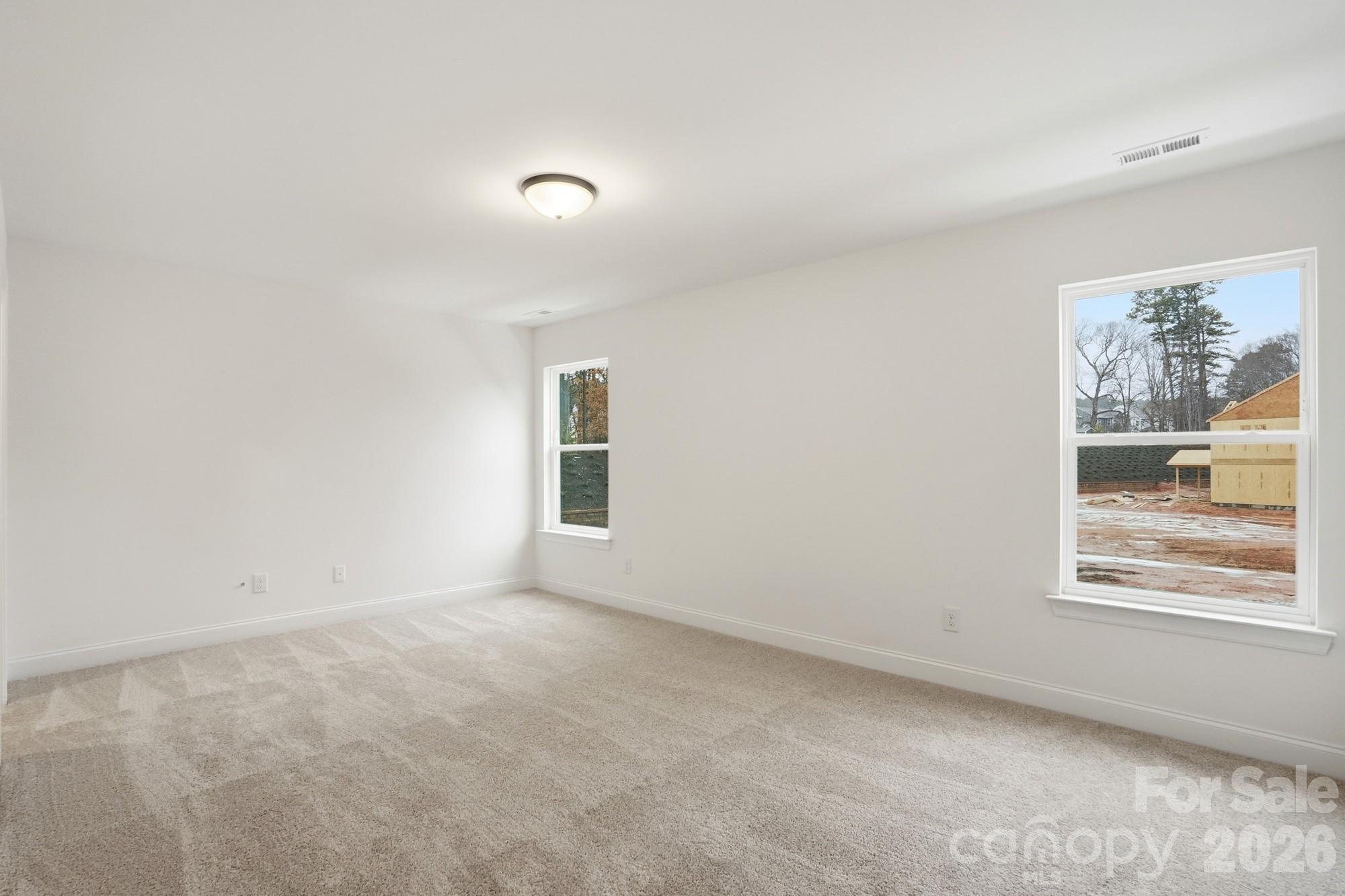 5072 Mclaughlin Loop Waxhaw, NC 28173 - Photo 38 of 46 an empty room with windows