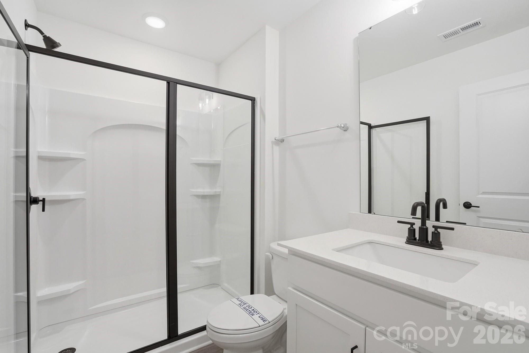 5072 Mclaughlin Loop Waxhaw, NC 28173 - Photo 40 of 46 a bathroom with a sink toilet and shower