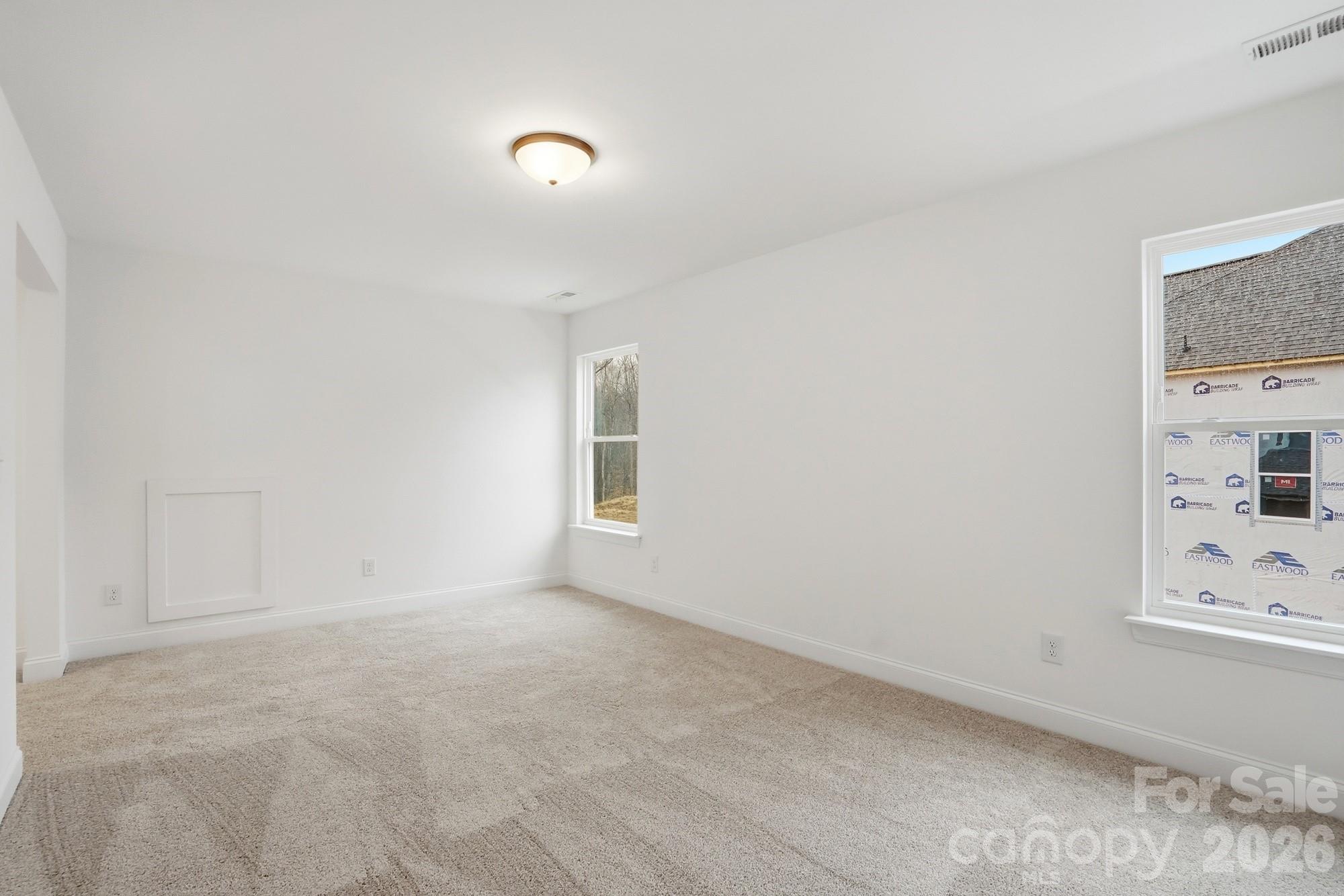 5072 Mclaughlin Loop Waxhaw, NC 28173 - Photo 43 of 46 a view of an empty room with a window