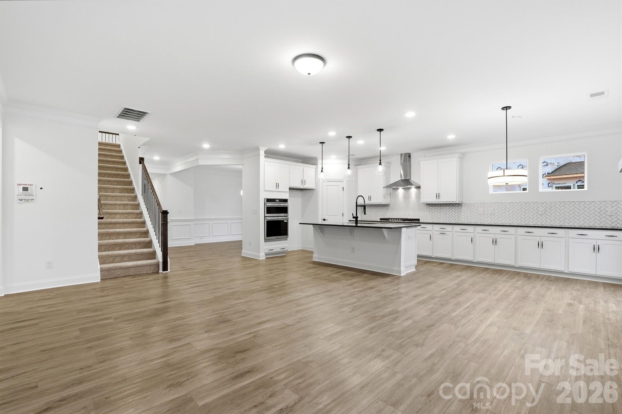 5072 Mclaughlin Loop Waxhaw, NC 28173 - Photo 8 of 46 a view of kitchen with wooden floor