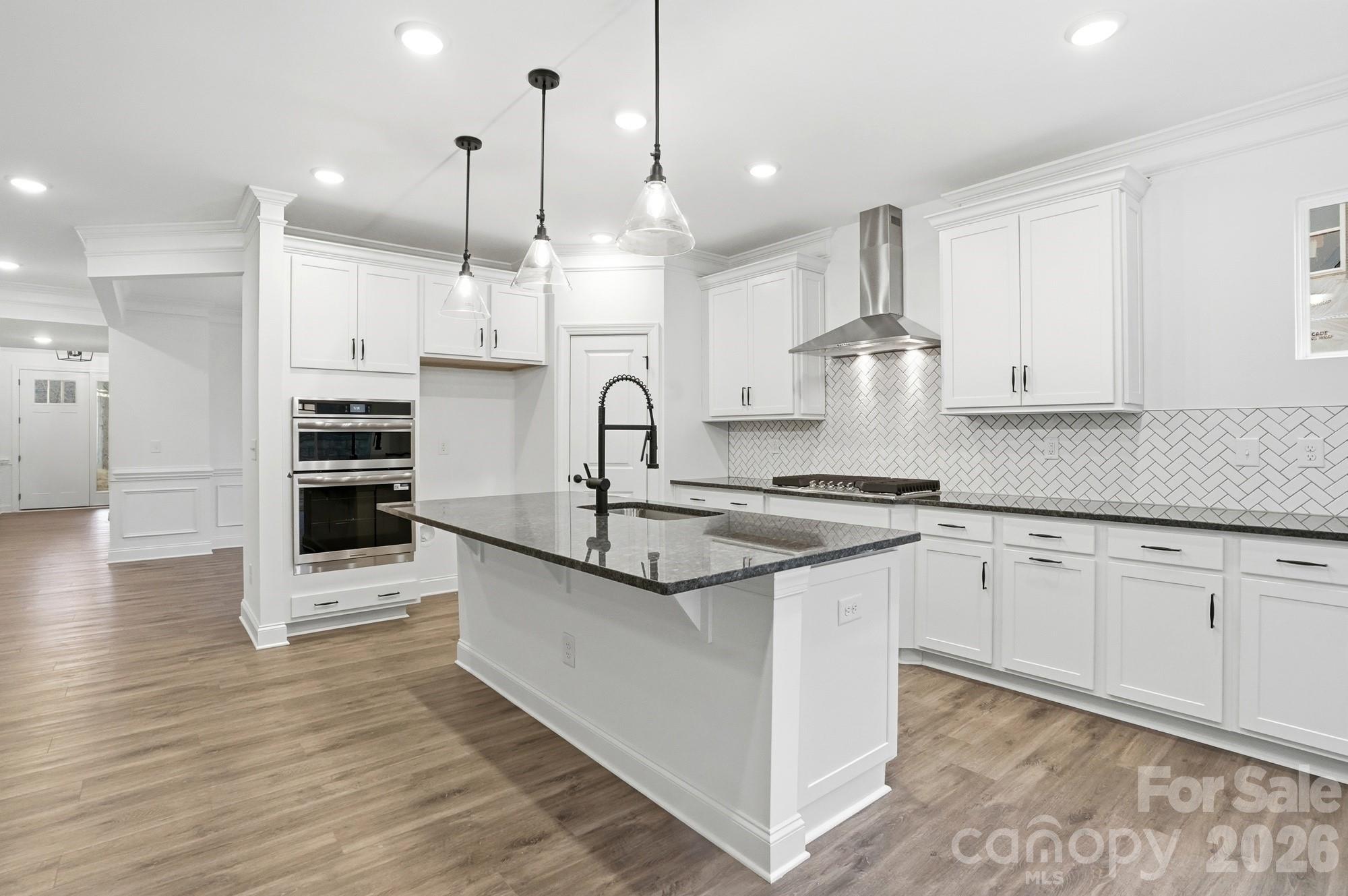 5072 Mclaughlin Loop Waxhaw, NC 28173 - Photo 10 of 46 a kitchen with stainless steel appliances granite countertop a sink and cabinets