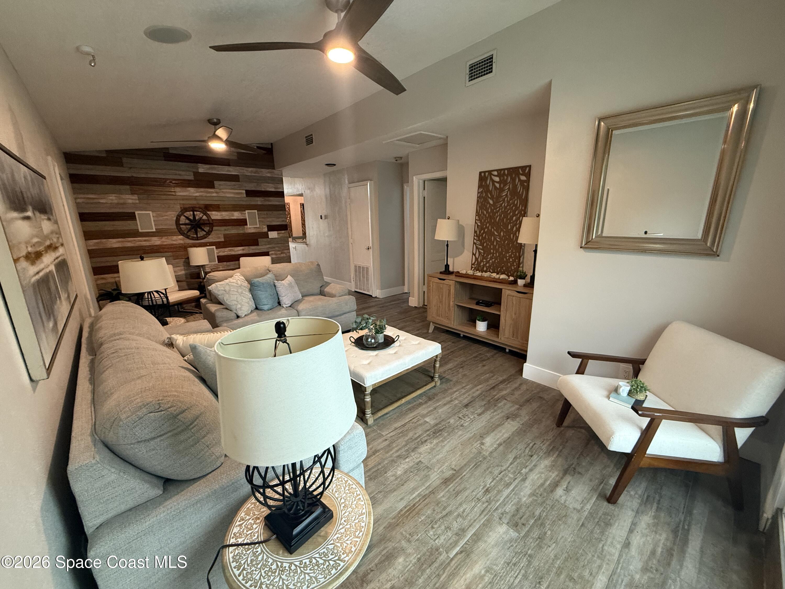 331 Avenida Del Sol Indialantic, FL 32903 - Photo 17 of 51 a living room with furniture and a flat screen tv
