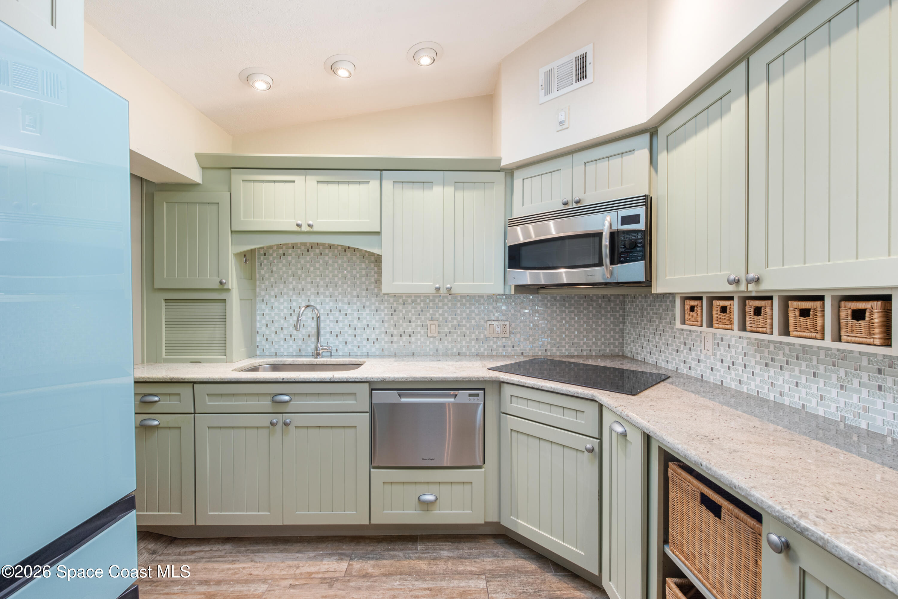 331 Avenida Del Sol Indialantic, FL 32903 - Photo 20 of 51 a kitchen with stainless steel appliances granite countertop a sink and stove top oven