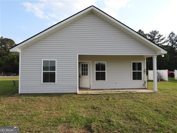 5915 Rye Patch Road Ludowici, GA 31316 - Photo 13 of 25 a front view of house with yard