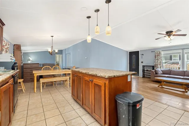 a kitchen with a stove a sink and a refrigerator
