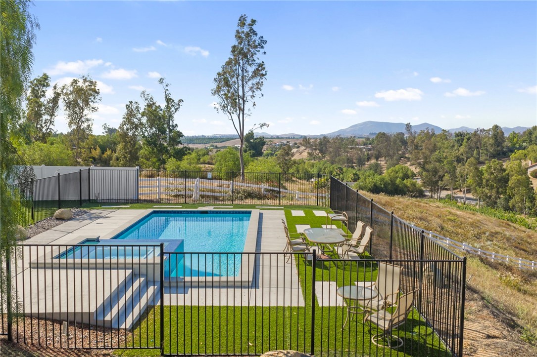 35825 Meadow Ridge Road Temecula, CA 92592 - Photo 24 of 75 a view of a balcony with wooden floor and fence