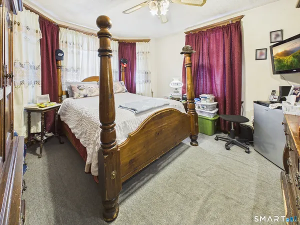 a white toilet sitting next to a bathroom sink