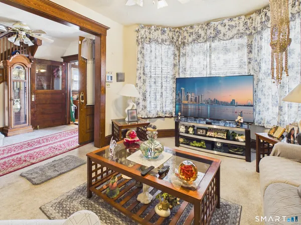 a kitchen with a refrigerator a microwave a stove and cabinets