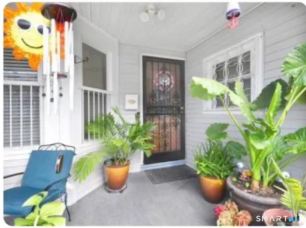 a view of staircase with white walls and windows