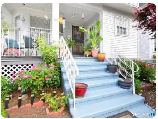 a view of a hallway with paintings on the wall