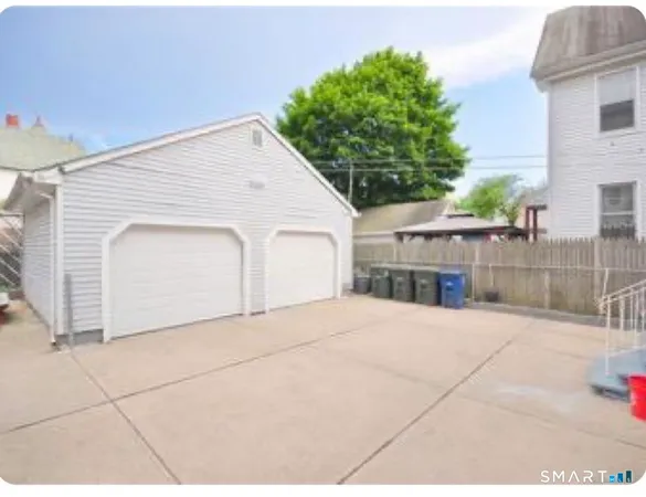 a bed room with a bed and a television