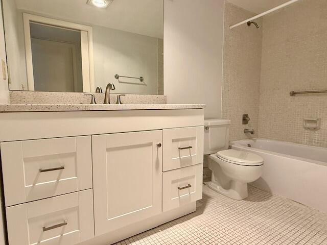 1043 Newcastle A Boca Raton, FL 33434 - Photo 13 of 17 a bathroom with a toilet a sink and a mirror