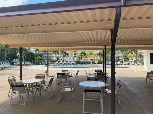 1043 Newcastle A Boca Raton, FL 33434 - Photo 17 of 17 a outdoor space with lots of tables and chairs