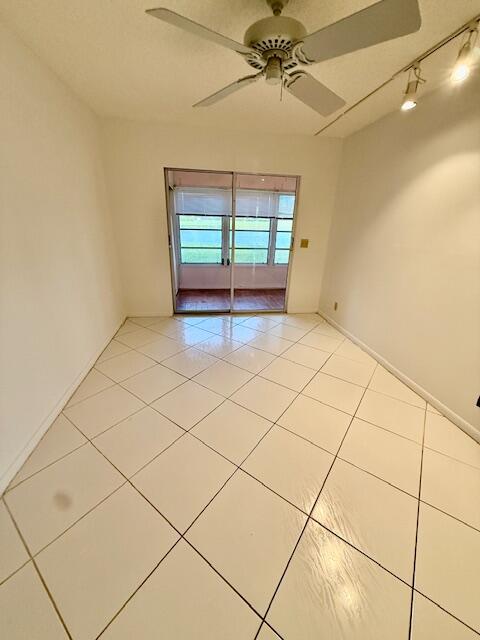 1043 Newcastle A Boca Raton, FL 33434 - Photo 9 of 17 a view of an empty room with a window