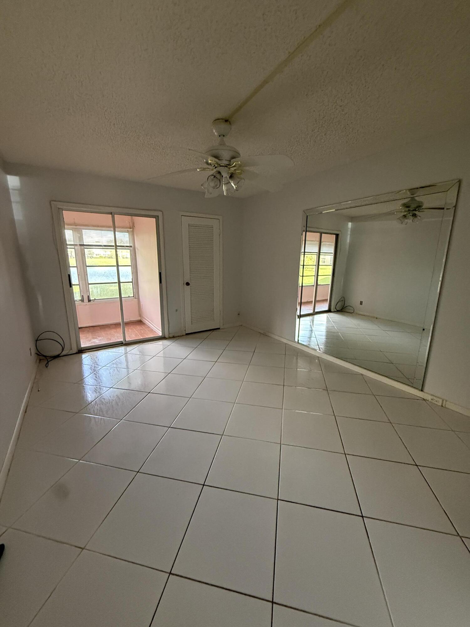 1043 Newcastle A Boca Raton, FL 33434 - Photo 10 of 17 a view of an empty room with a window