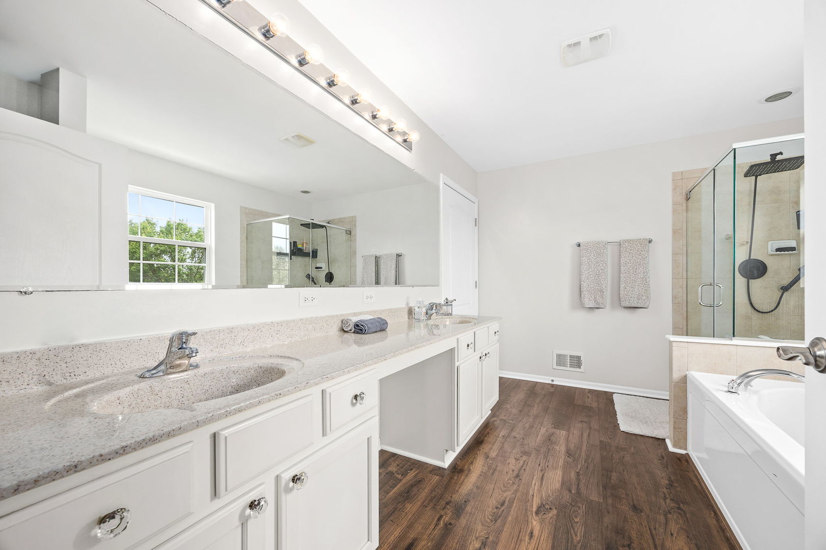 2297 Deerpath Road Bolingbrook, IL 60490 - Photo 33 of 46 a spacious bathroom with a granite countertop double vanity sink a mirror and a bathtub