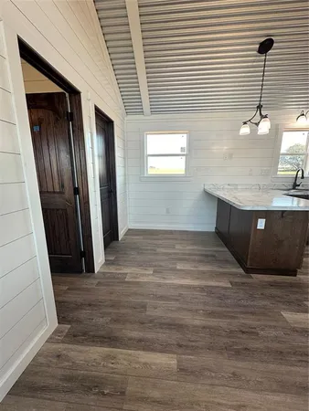 a view of a kitchen from the hallway