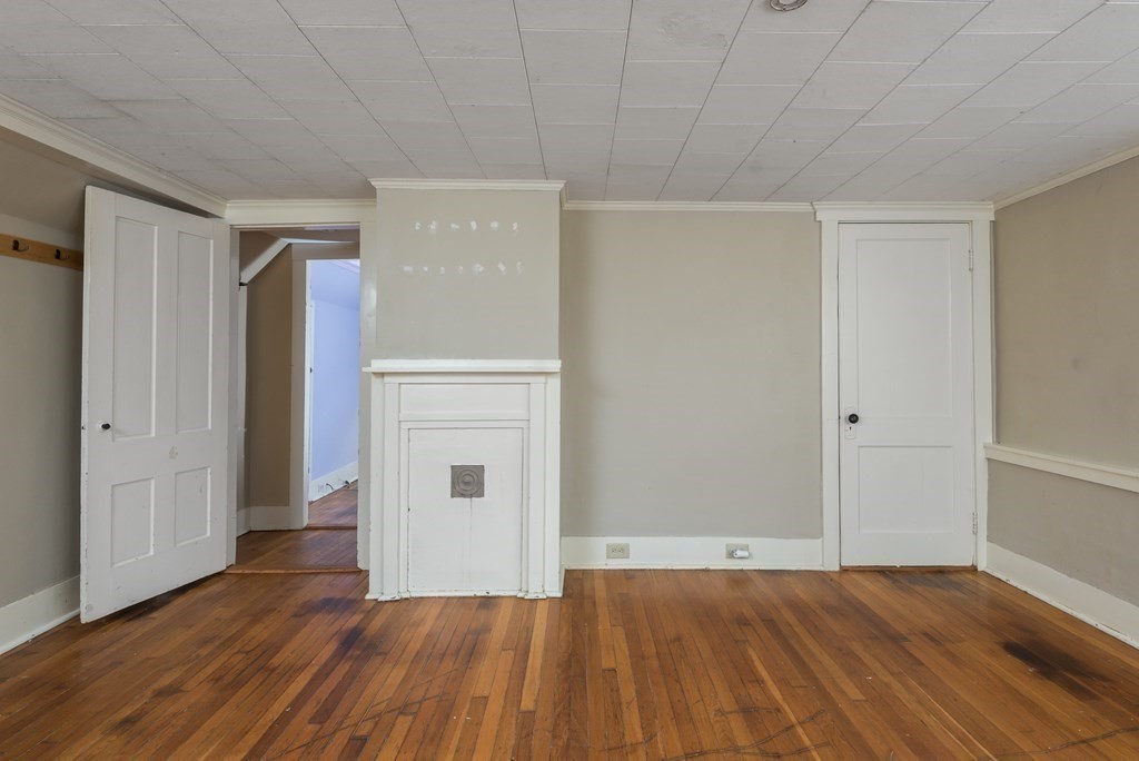 716 High Street Hanson, MA 02341 - Photo 12 of 21 a view of an empty room with wooden floor and closet