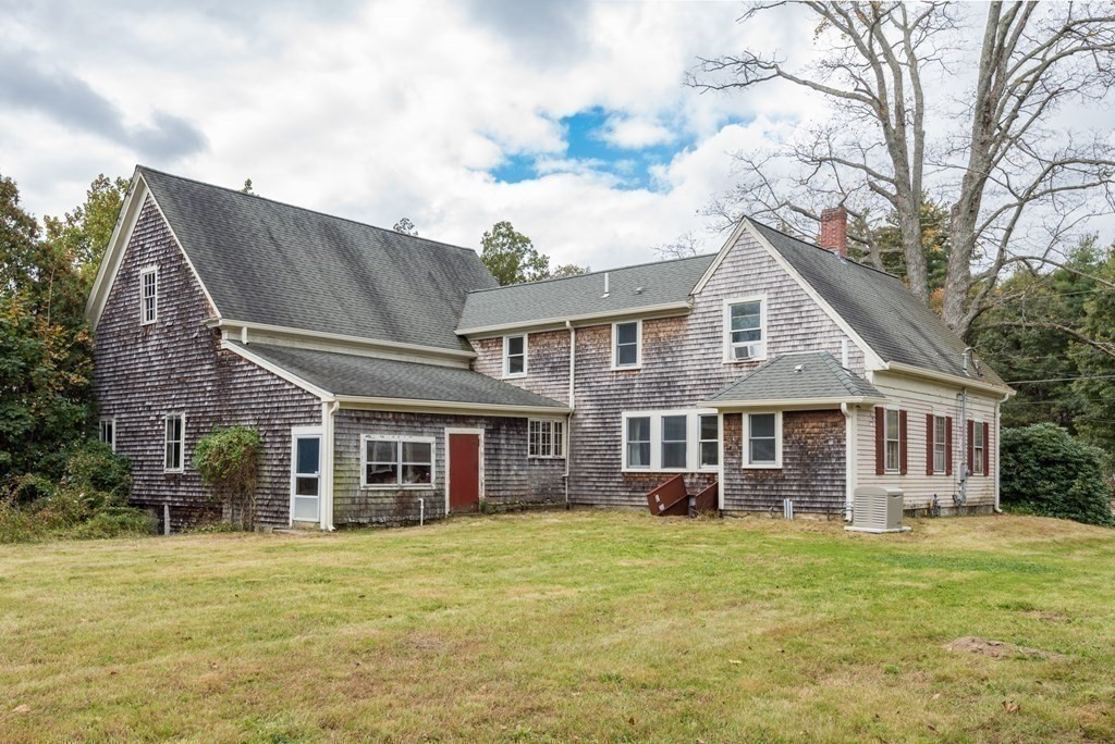 716 High Street Hanson, MA 02341 - Photo 16 of 21 a front view of a house with a garden