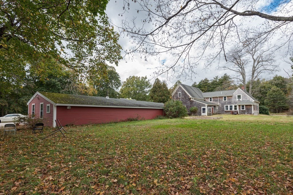 716 High Street Hanson, MA 02341 - Photo 17 of 21 a view of a big house with a big yard and large trees