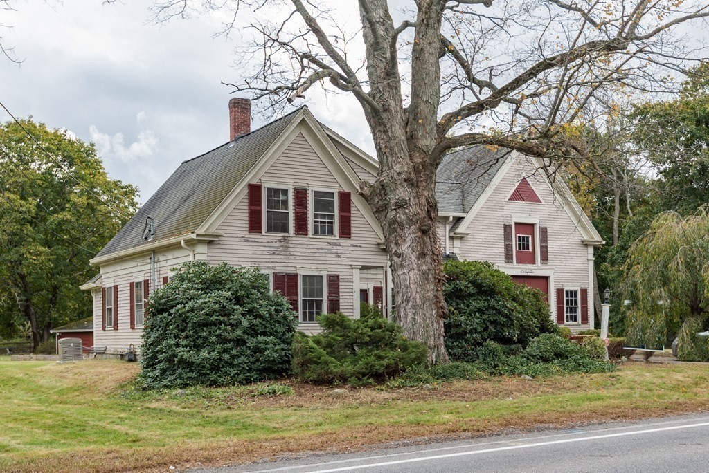 716 High Street Hanson, MA 02341 - Photo 2 of 21 a front view of a house with a yard