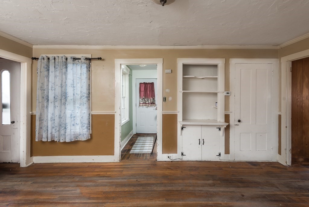 716 High Street Hanson, MA 02341 - Photo 5 of 21 a view of a livingroom with wooden floor and a window