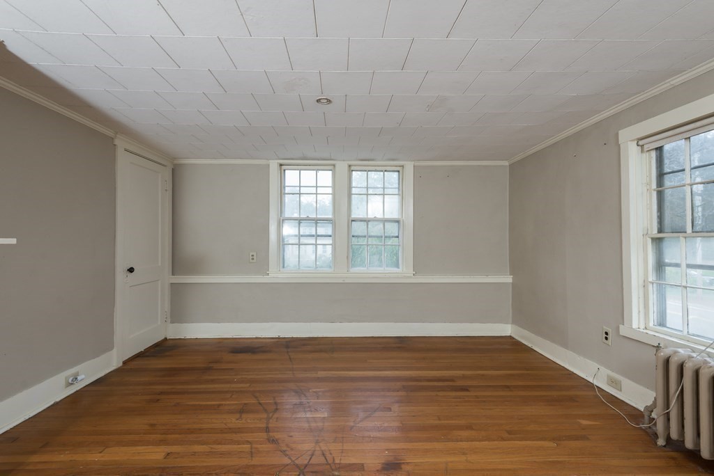 716 High Street Hanson, MA 02341 - Photo 10 of 21 wooden floor in an empty room with a window