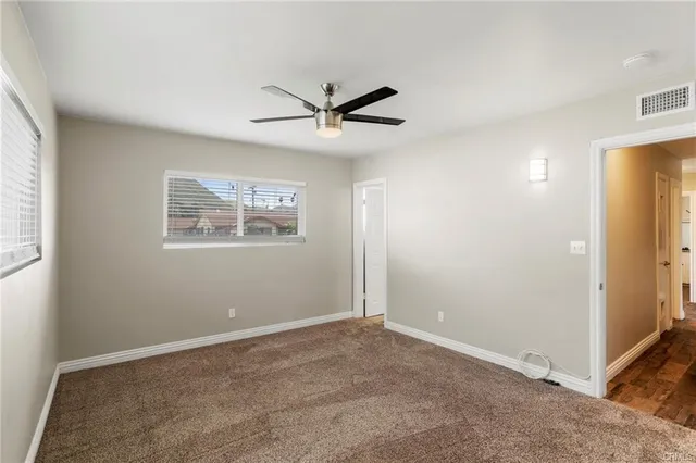 a view of a big room with carpet