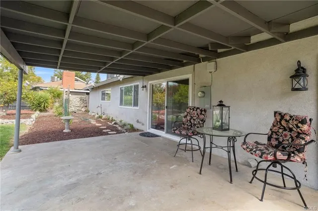 a view of a chairs and table in the patio