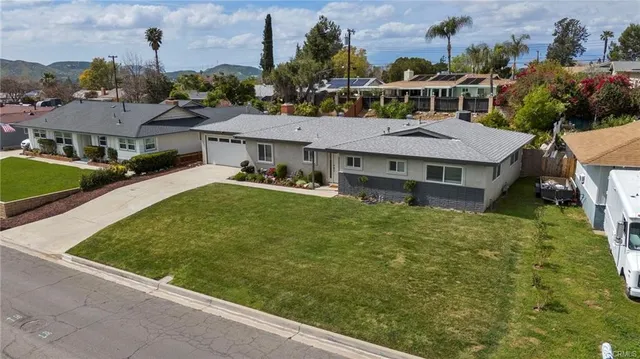 a aerial view of a house with a garden and plants