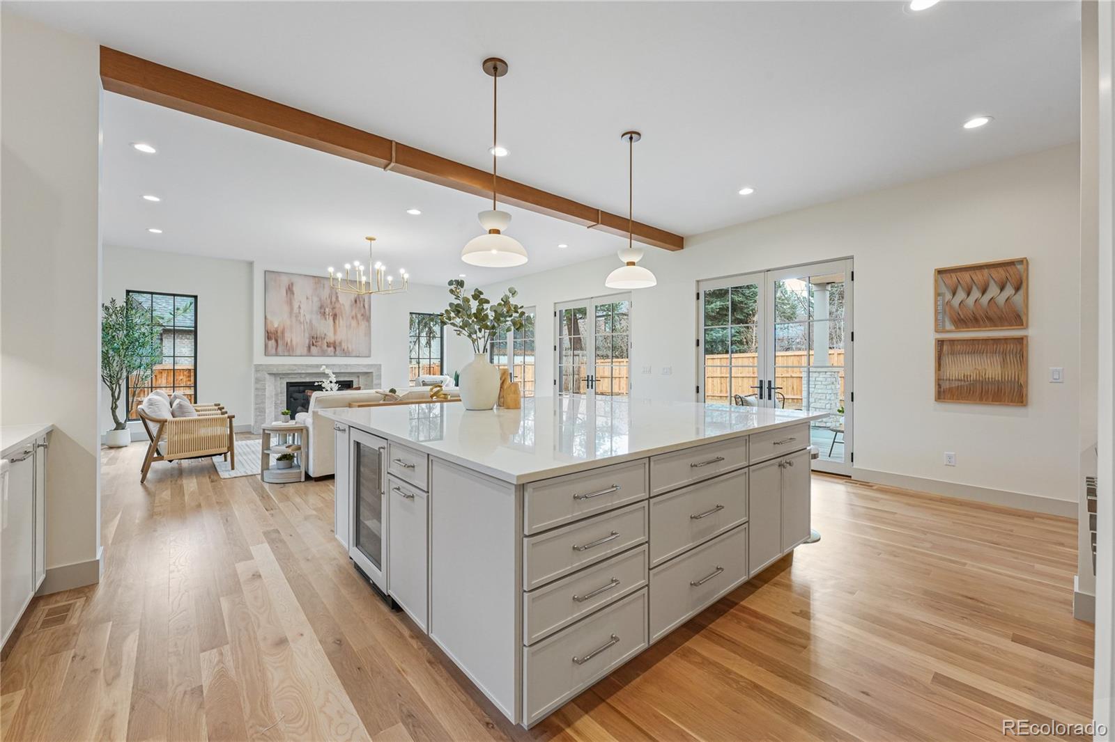 354 Cherry Street Denver, CO 80220 - Photo 16 of 44 a kitchen with stainless steel appliances granite countertop a lot of counter space and wooden floors