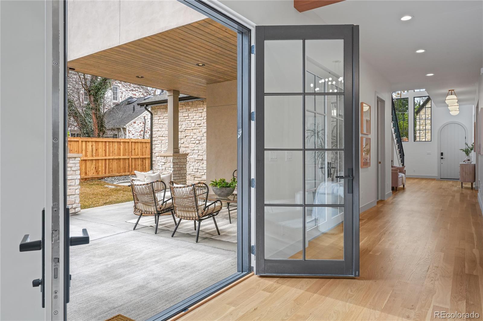 354 Cherry Street Denver, CO 80220 - Photo 19 of 44 a view of a living room hardwood floor and a large window