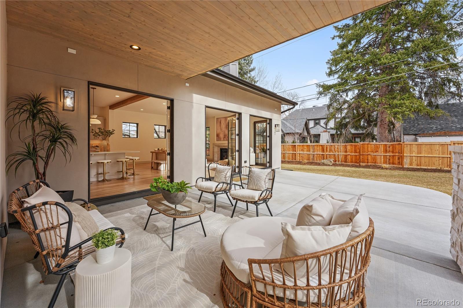 354 Cherry Street Denver, CO 80220 - Photo 20 of 44 a living room with patio furniture and a floor to ceiling window
