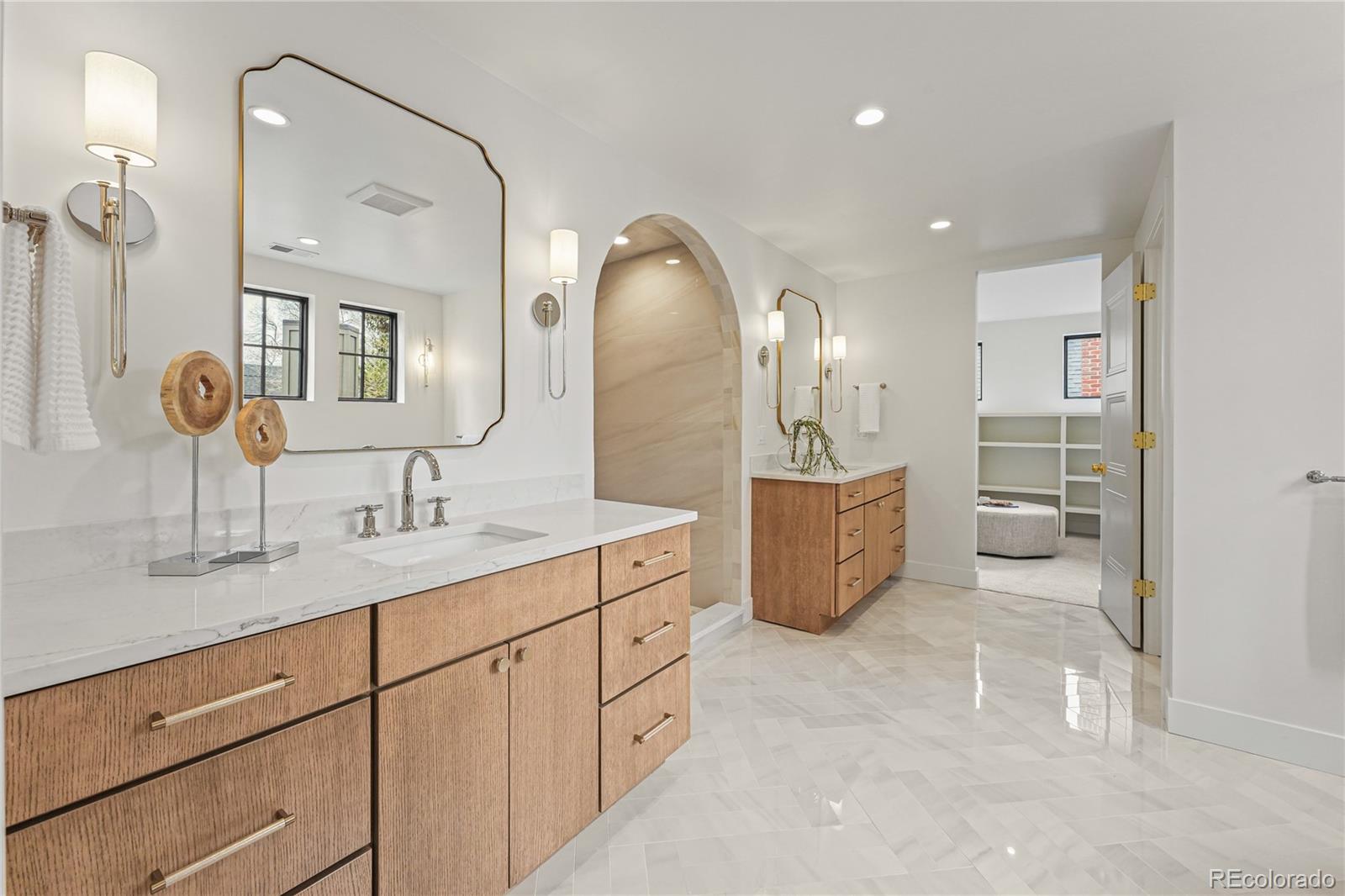 354 Cherry Street Denver, CO 80220 - Photo 28 of 44 a spacious bathroom with a double vanity sink and mirror
