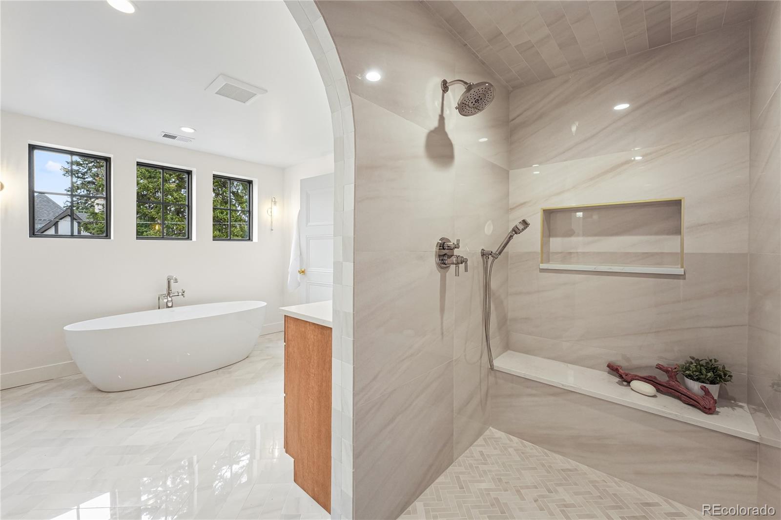 354 Cherry Street Denver, CO 80220 - Photo 29 of 44 a bathroom with a bathtub and a shower