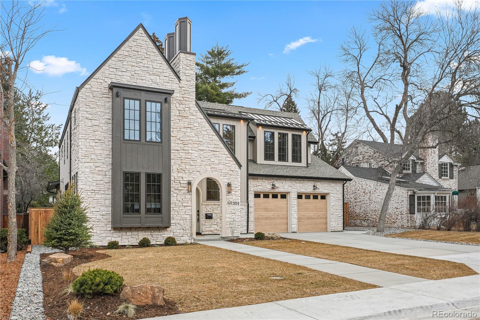 354 Cherry Street Denver, CO 80220 - Photo 3 of 44 a front view of a house with a yard